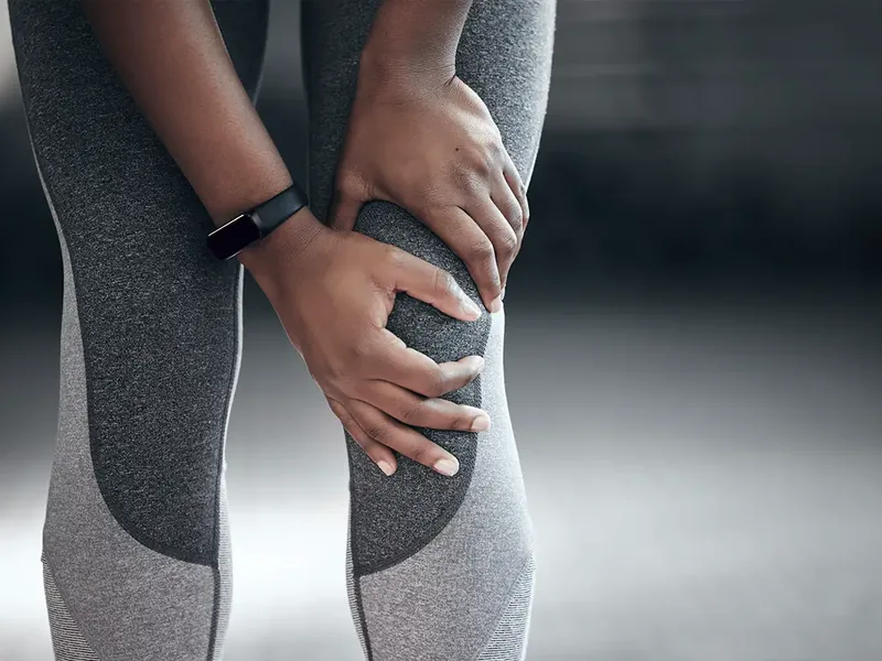 Hands-on knee assessment during a treatment session